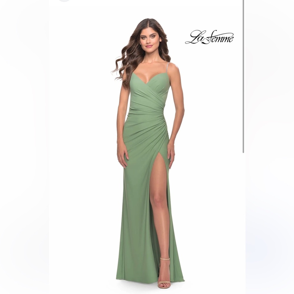 La Femme dress with ruching and high leg slit complimented by jeweled strap